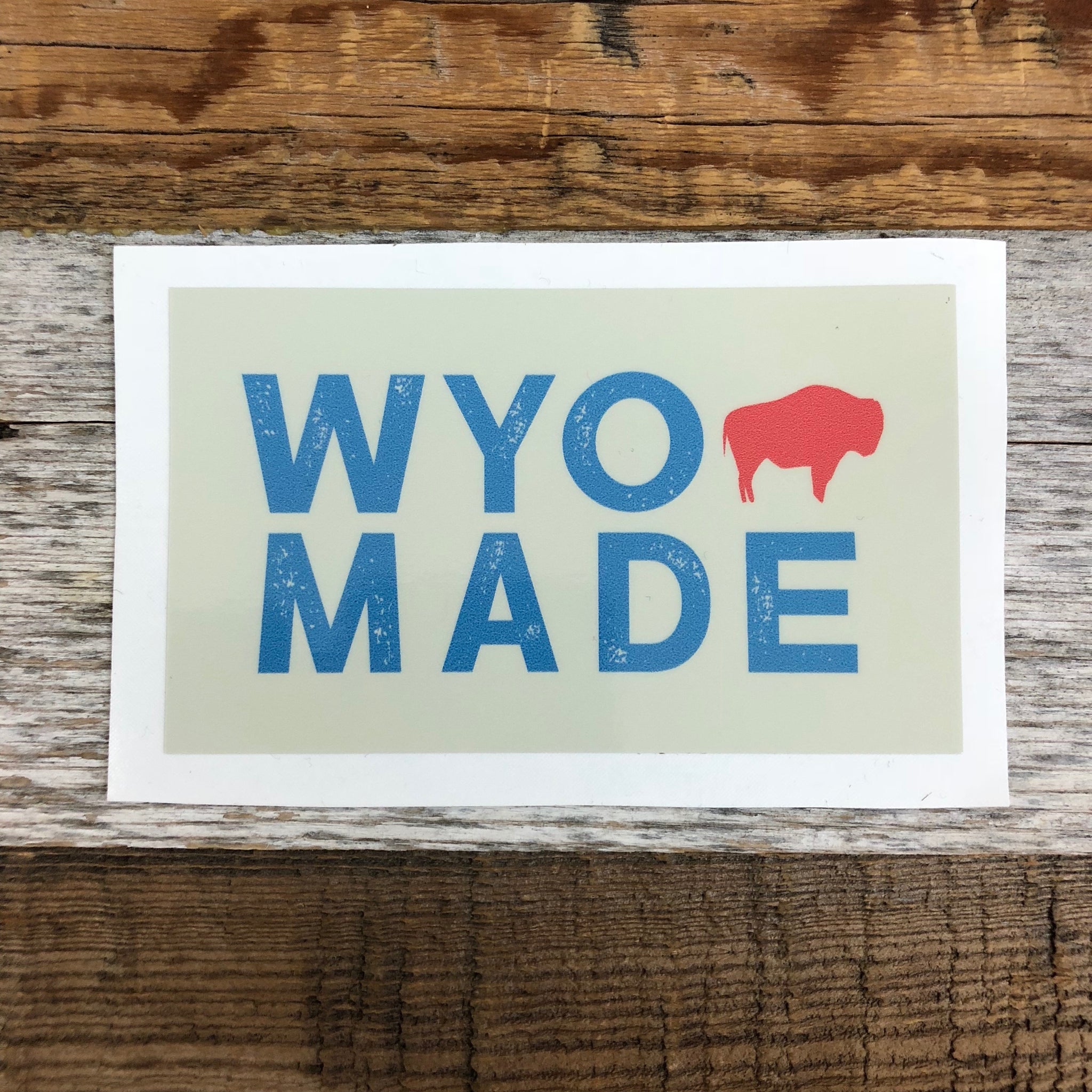 The New Bison Moon is a modern twist on our long time iconic design from WyoMade!   The Bison represents freedom and is a staple of Wyoming's open spaces. This sticker is sure to appease your desire to roam free.  Be a part of the herd with the WyoMade Tag Logo Sticker from Wyomade.     Size:  2.4" x 4"